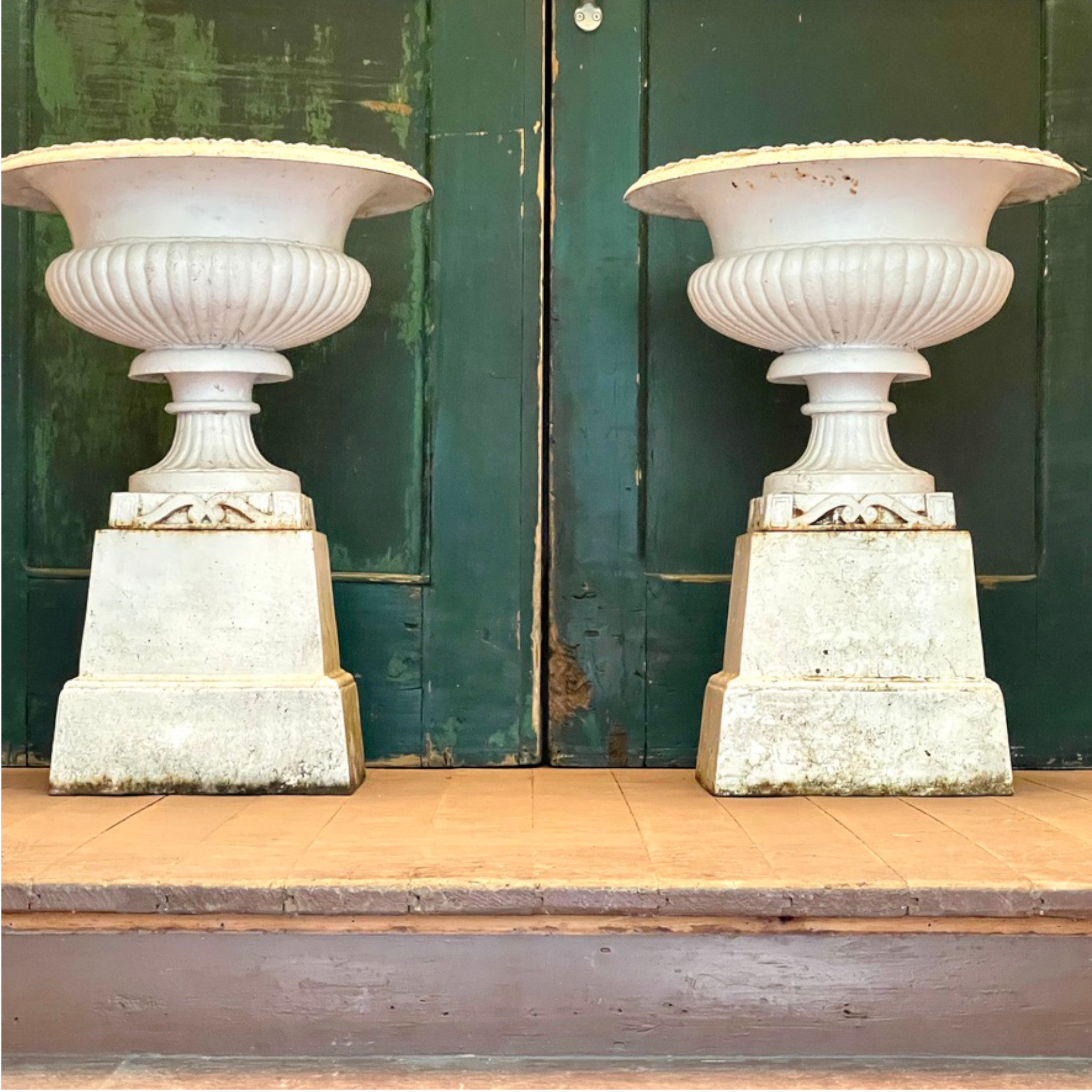 Pair of Cast Iron Campana Urns on Plinths, Vintage Patina