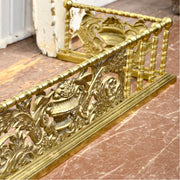 Vintage brass fireplace fender — classical urn motif