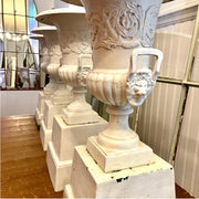 Set of Four Cast Iron Garden Urns with Lion Mask Handles on Plinths